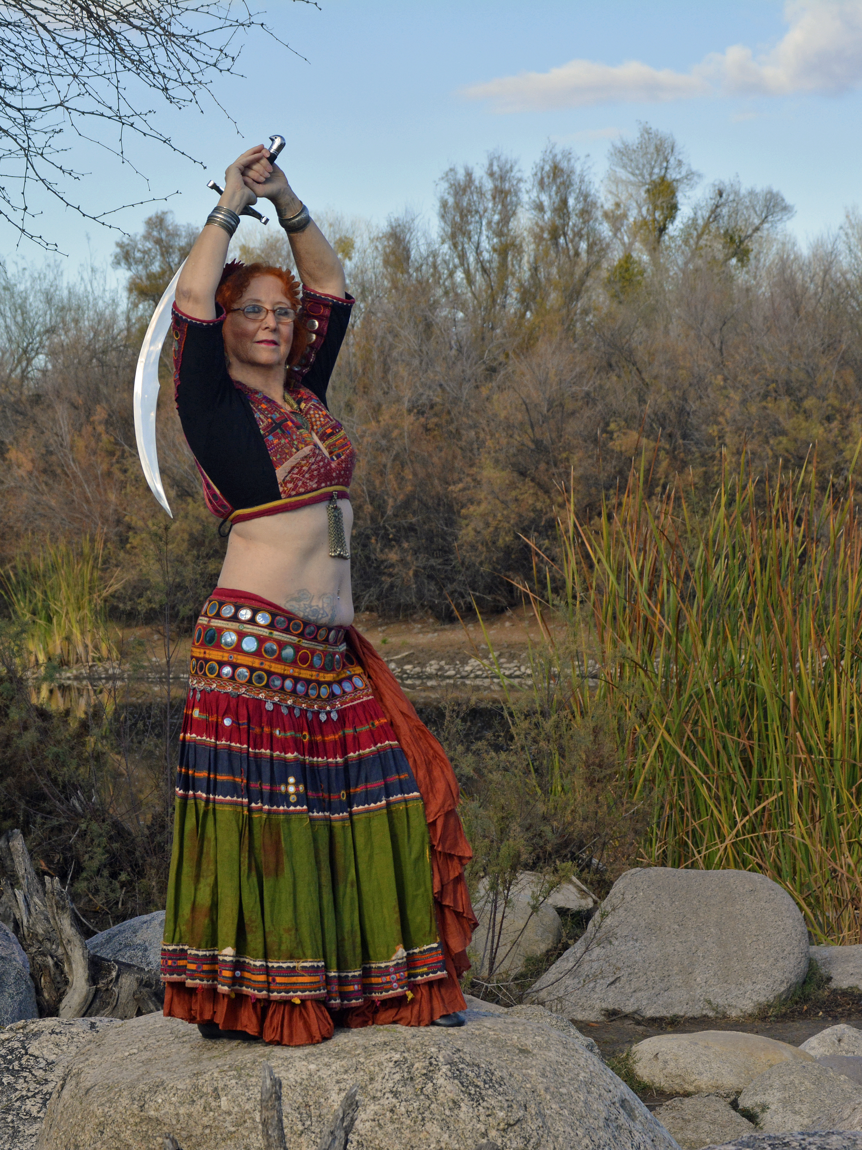 Dancer with single sword by the river